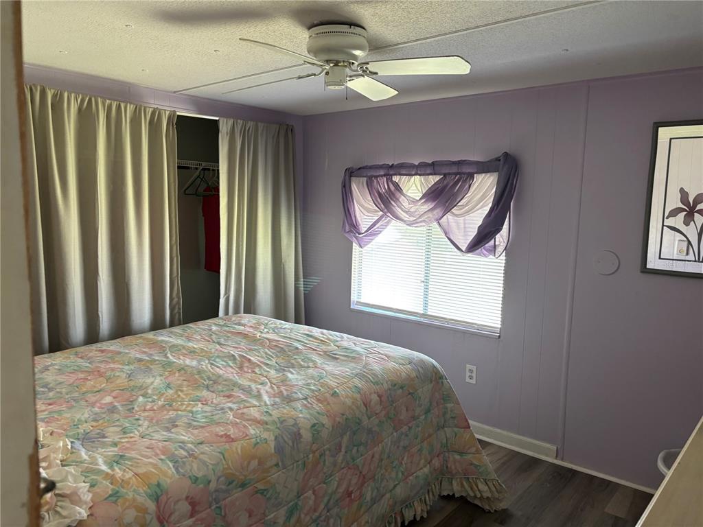 3346 Chatford Drive Holiday, FL 34690 - Photo 4 of 10 a bedroom with a bed and a window