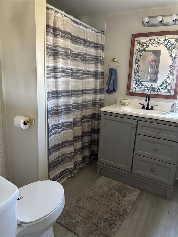 3346 Chatford Drive Holiday, FL 34690 - Photo 5 of 10 a bathroom with a toilet sink and shower