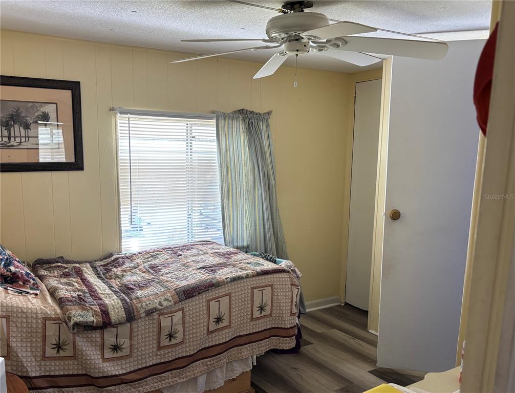 3346 Chatford Drive Holiday, FL 34690 - Photo 6 of 10 a bedroom with a bed and a window