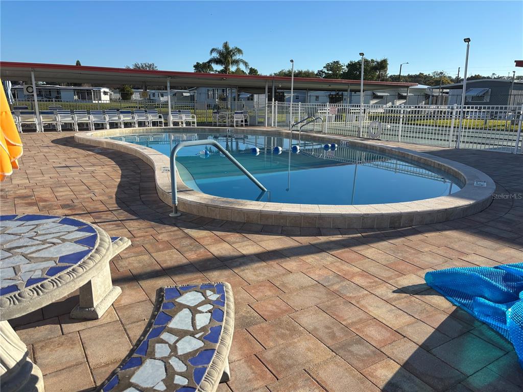 3346 Chatford Drive Holiday, FL 34690 - Photo 10 of 10 a view of a swimming pool with a lounge chairs