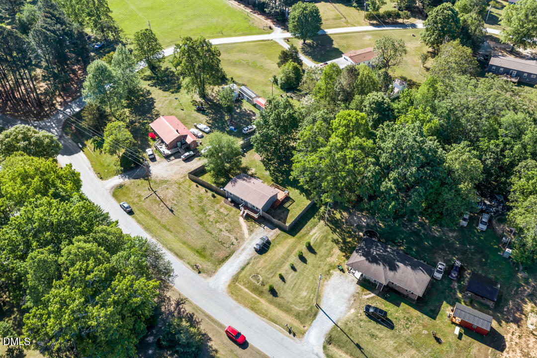 454 Cedar Creek Road Timberlake, NC 27583 - Photo 36 of 39 an aerial view of a house a yard and a fire pit
