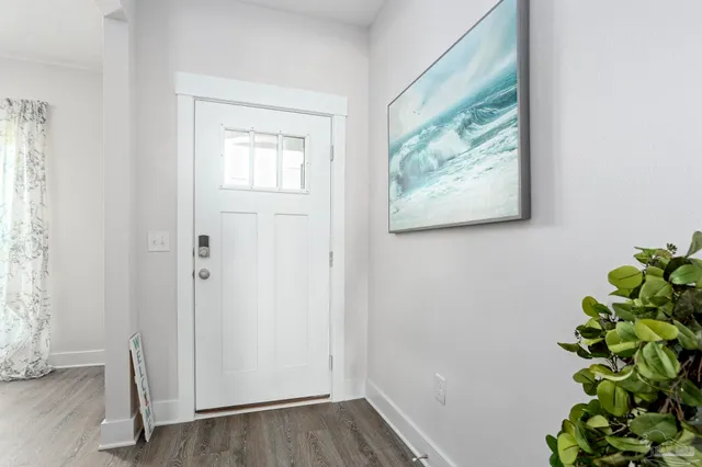 a view of front door with wooden floor