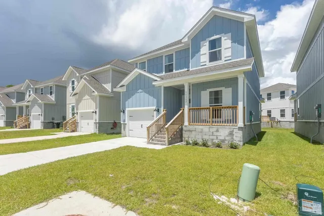 a house view with swimming pool and wooden fence