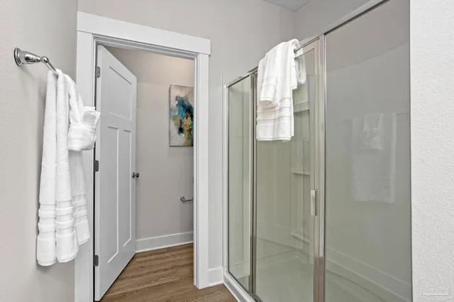 a bathroom with a shower and a sink