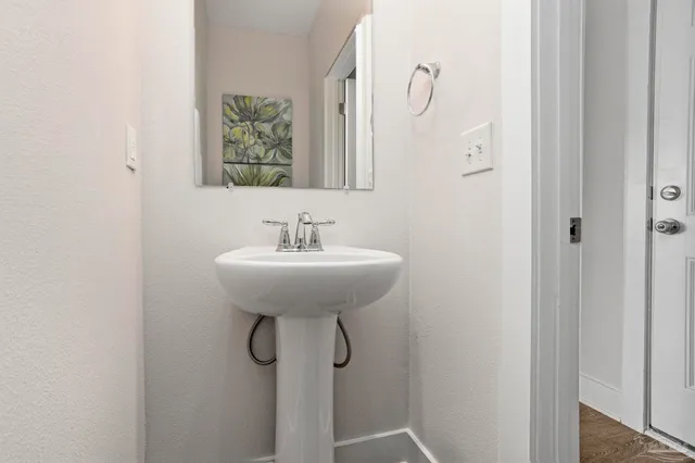 a bathroom with a sink and mirror