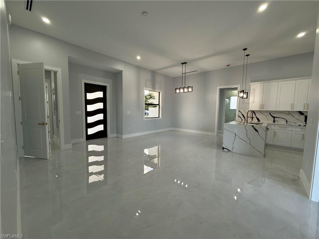 4353 22nd Avenue Northeast Naples, FL 34120 - Photo 14 of 18 a view of a room with gym equipment