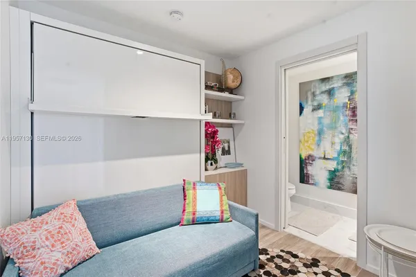 a living room with furniture and a gate
