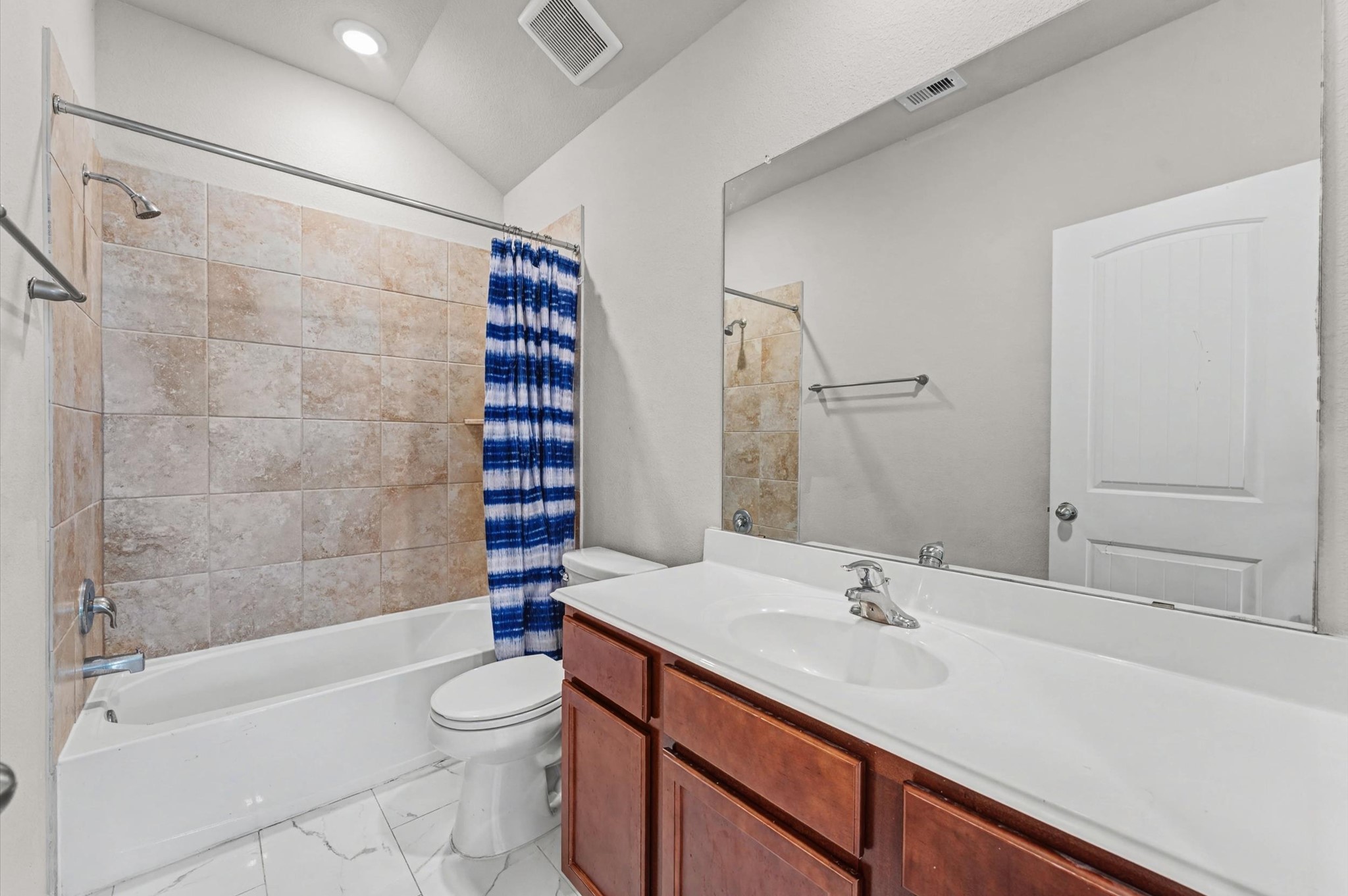 21610 Lemon Beebrush Lane Katy, TX 77449 - Photo 13 of 25 a bathroom with a sink a toilet and shower