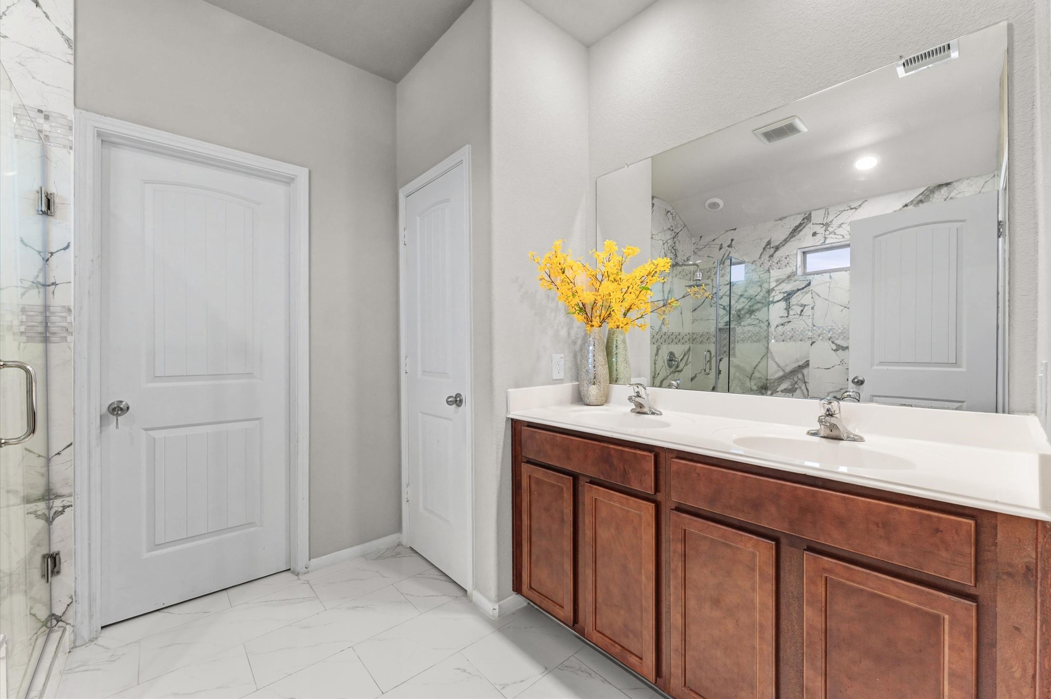 21610 Lemon Beebrush Lane Katy, TX 77449 - Photo 15 of 25 a bathroom with a double vanity sink mirror and double