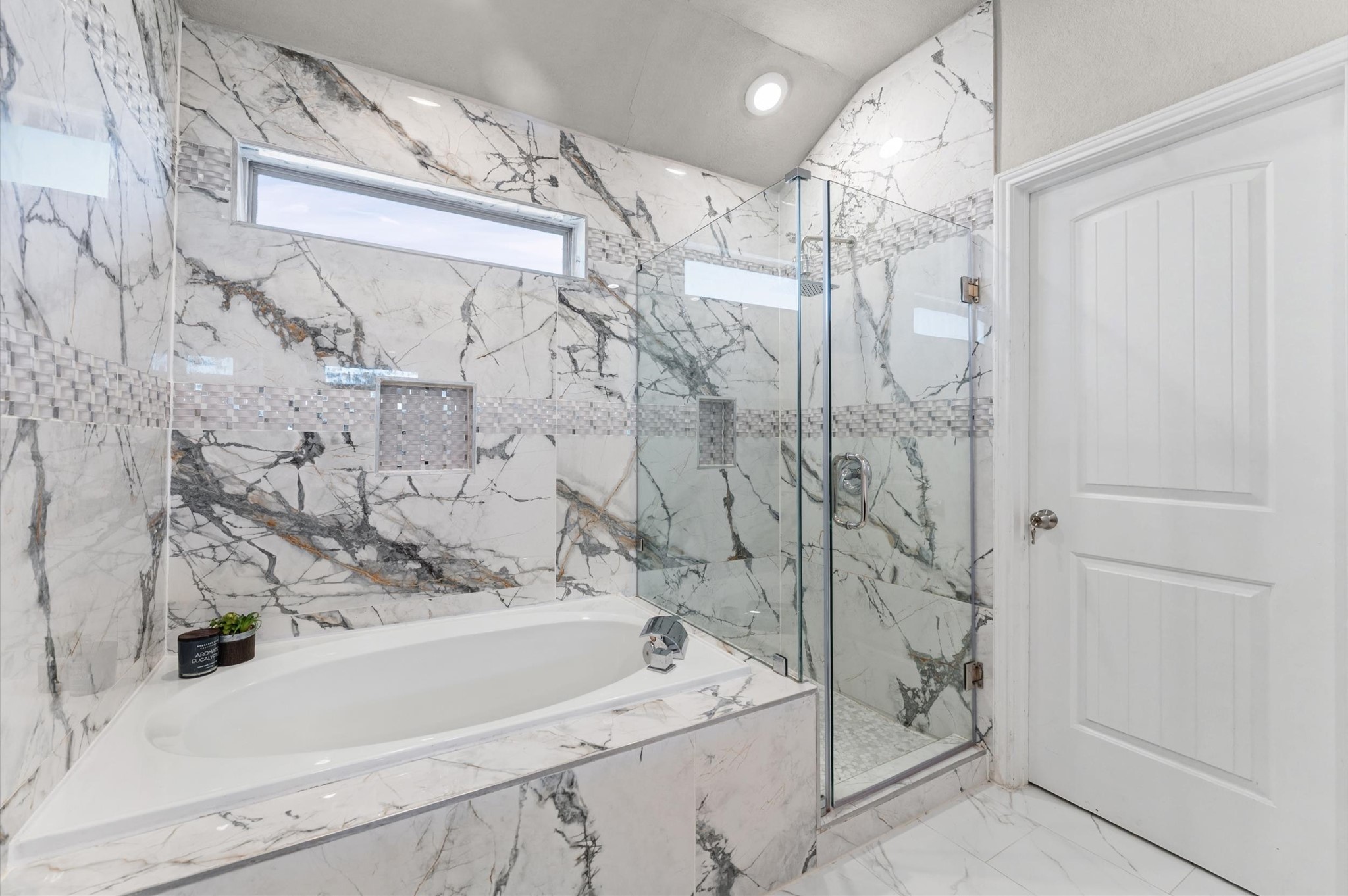 21610 Lemon Beebrush Lane Katy, TX 77449 - Photo 16 of 25 a bathroom with a bathtub and shower