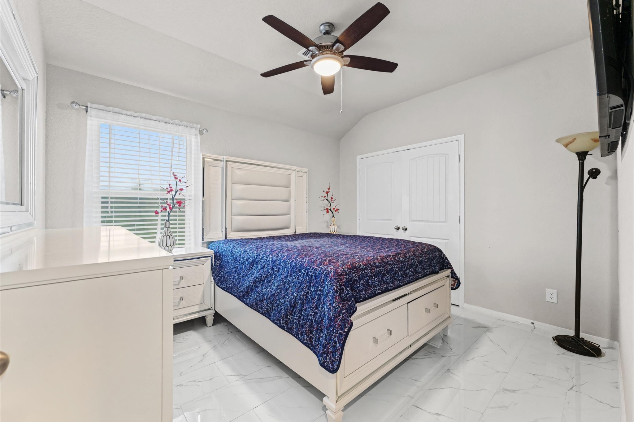 21610 Lemon Beebrush Lane Katy, TX 77449 - Photo 17 of 25 a spacious bedroom with a bed and a window