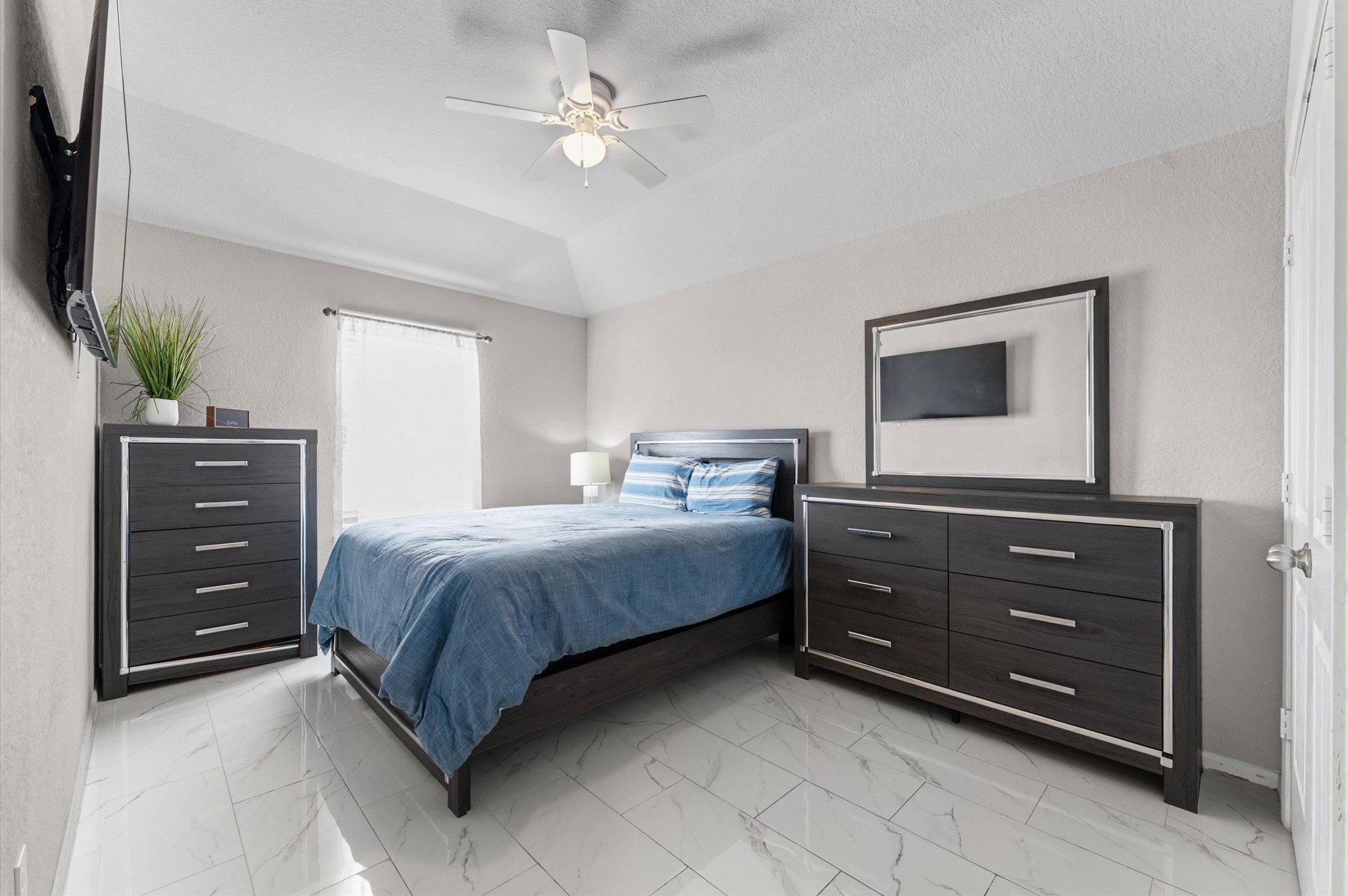 21610 Lemon Beebrush Lane Katy, TX 77449 - Photo 18 of 25 a bedroom with a bed and a dresser