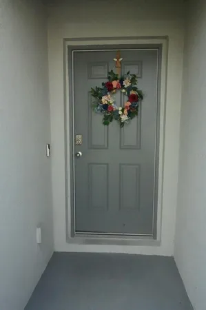 a vase of flowers sitting on a shelf