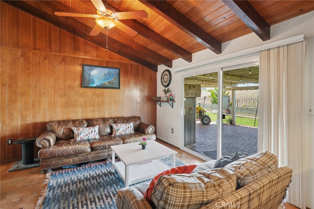 6769 Sunset Circle Riverside, CA 92505 - Photo 19 of 54 a living room with furniture and a floor to ceiling window