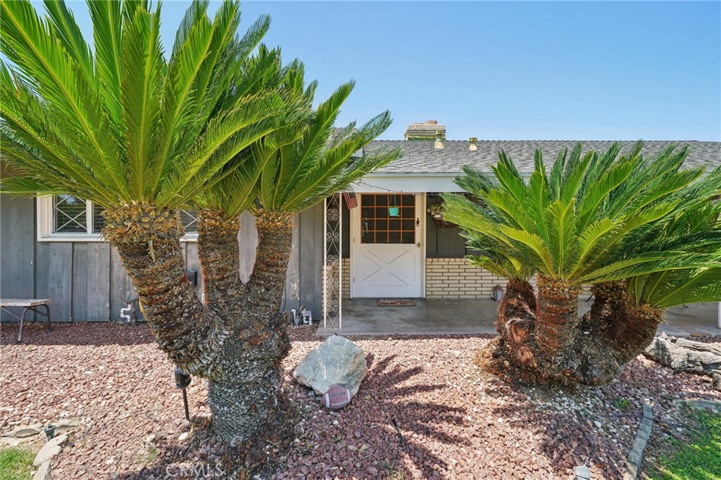 6769 Sunset Circle Riverside, CA 92505 - Photo 7 of 54 a view of a house with a tree in the background