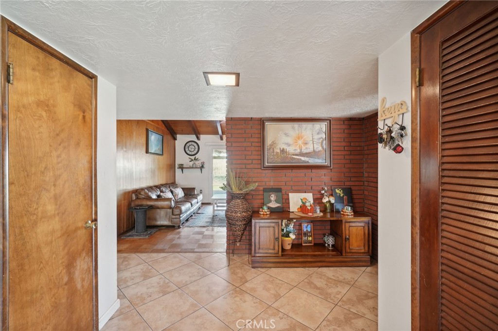 6769 Sunset Circle Riverside, CA 92505 - Photo 9 of 54 a living room with furniture and a window