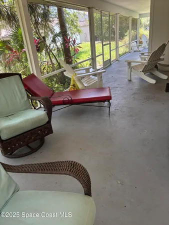 a room with furniture and a large window