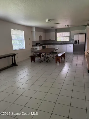 a room with gym equipment and a window