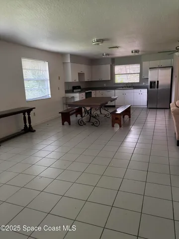 a room with gym equipment and a window