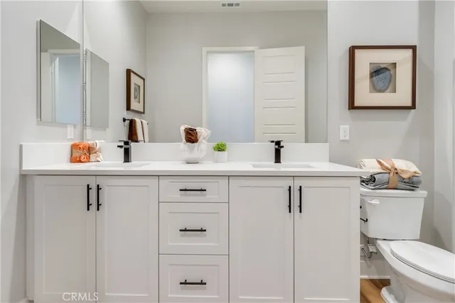 a bathroom with a shower and a sink
