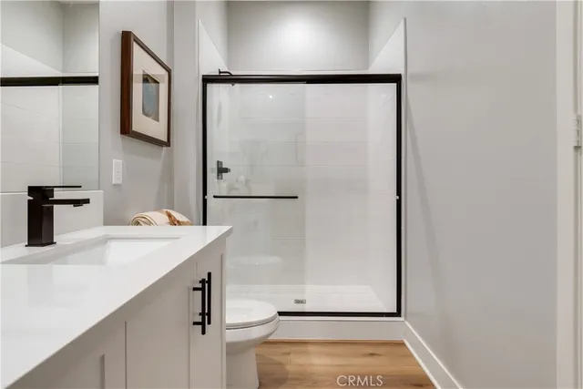 a bedroom with a bed and a desk