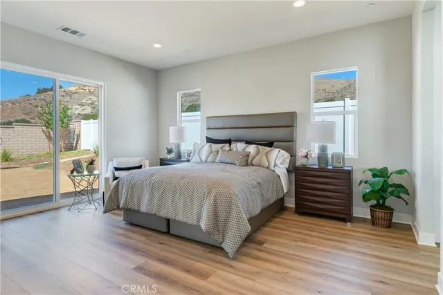 a bedroom with a bed and a couch