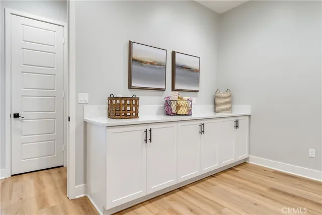 a bedroom with two beds and a table