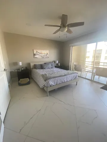 a bedroom with a bed and a mirror