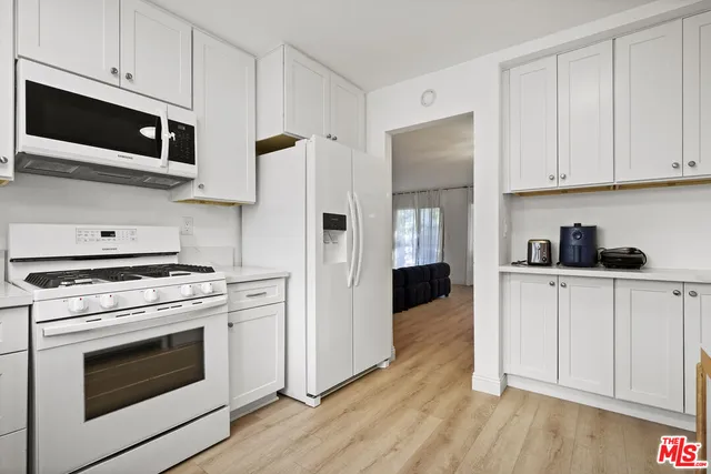 a bathroom with a toilet a sink and a mirror