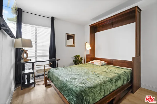 a view of a patio with table and chairs and potted plants