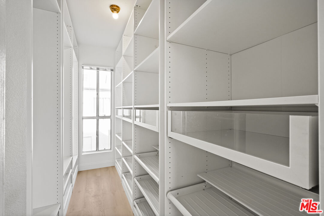 5245 Coldwater Canyon Avenue, Unit C Sherman Oaks, CA 91401 - Photo 29 of 55 a view of walk in closet with empty racks