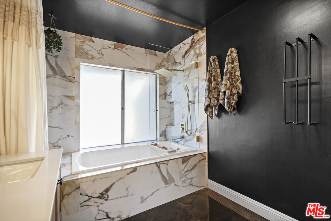 5245 Coldwater Canyon Avenue, Unit C Sherman Oaks, CA 91401 - Photo 31 of 55 a bathroom with a bathtub and shower