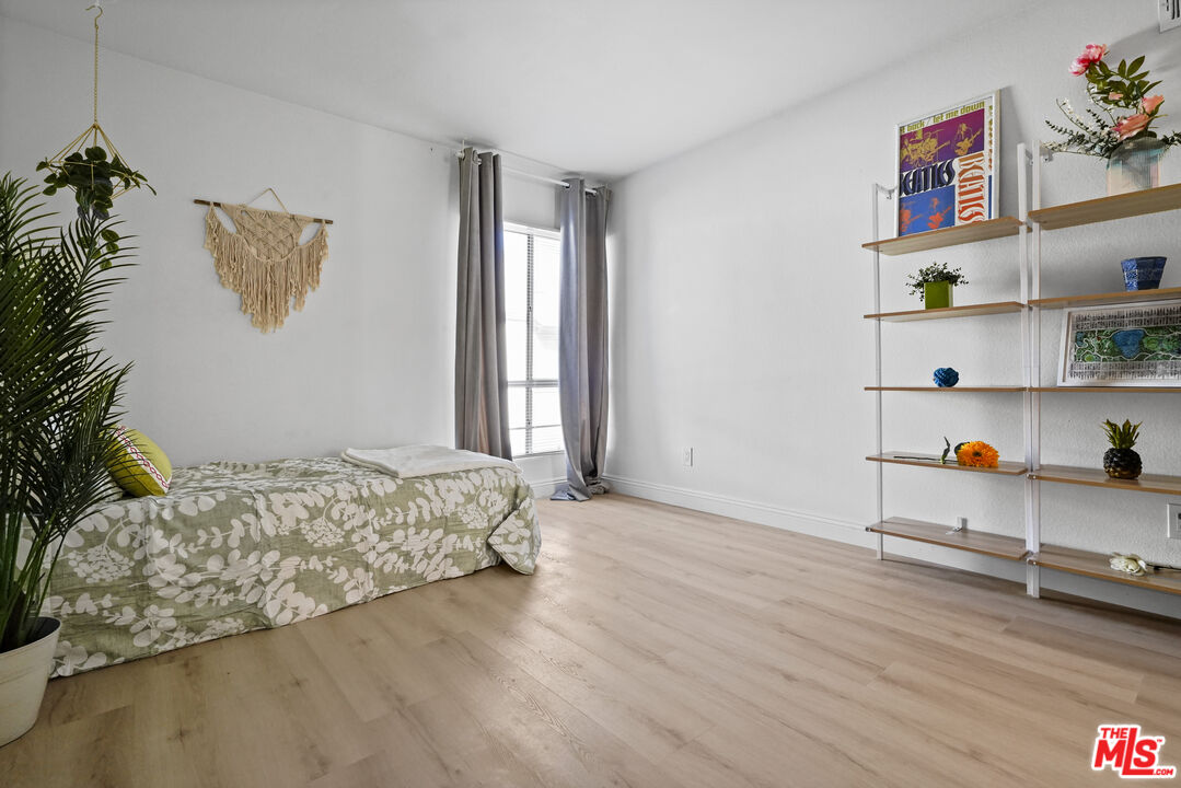 5245 Coldwater Canyon Avenue, Unit C Sherman Oaks, CA 91401 - Photo 35 of 55 a bedroom with a bed and a window
