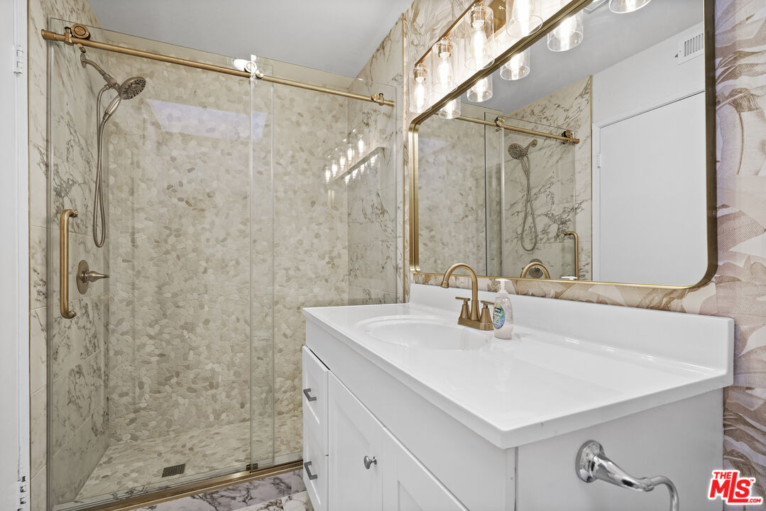 5245 Coldwater Canyon Avenue, Unit C Sherman Oaks, CA 91401 - Photo 37 of 55 a bathroom with a sink mirror and shower