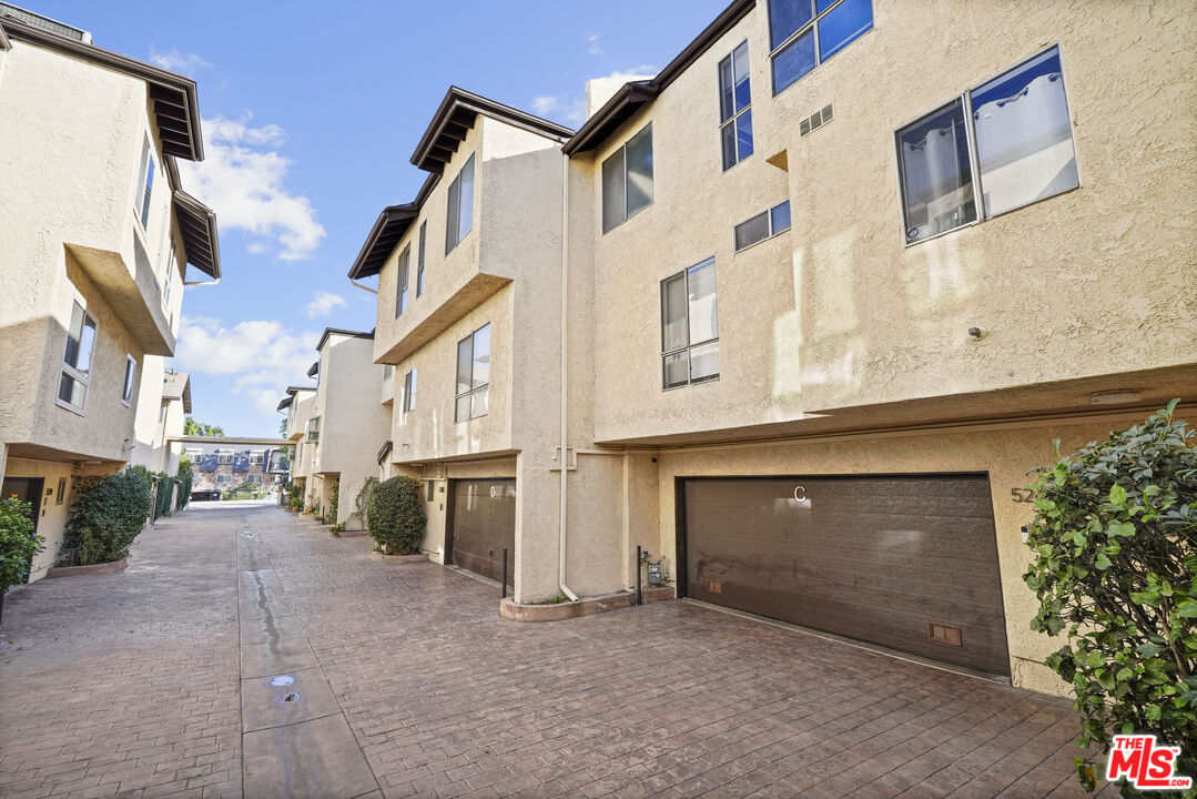 5245 Coldwater Canyon Avenue, Unit C Sherman Oaks, CA 91401 - Photo 44 of 55 a view of a street with big house