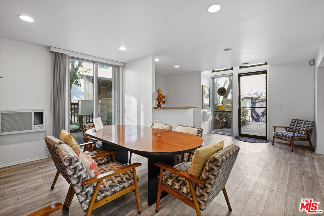 5245 Coldwater Canyon Avenue, Unit C Sherman Oaks, CA 91401 - Photo 51 of 55 a dining room with furniture and wooden floor