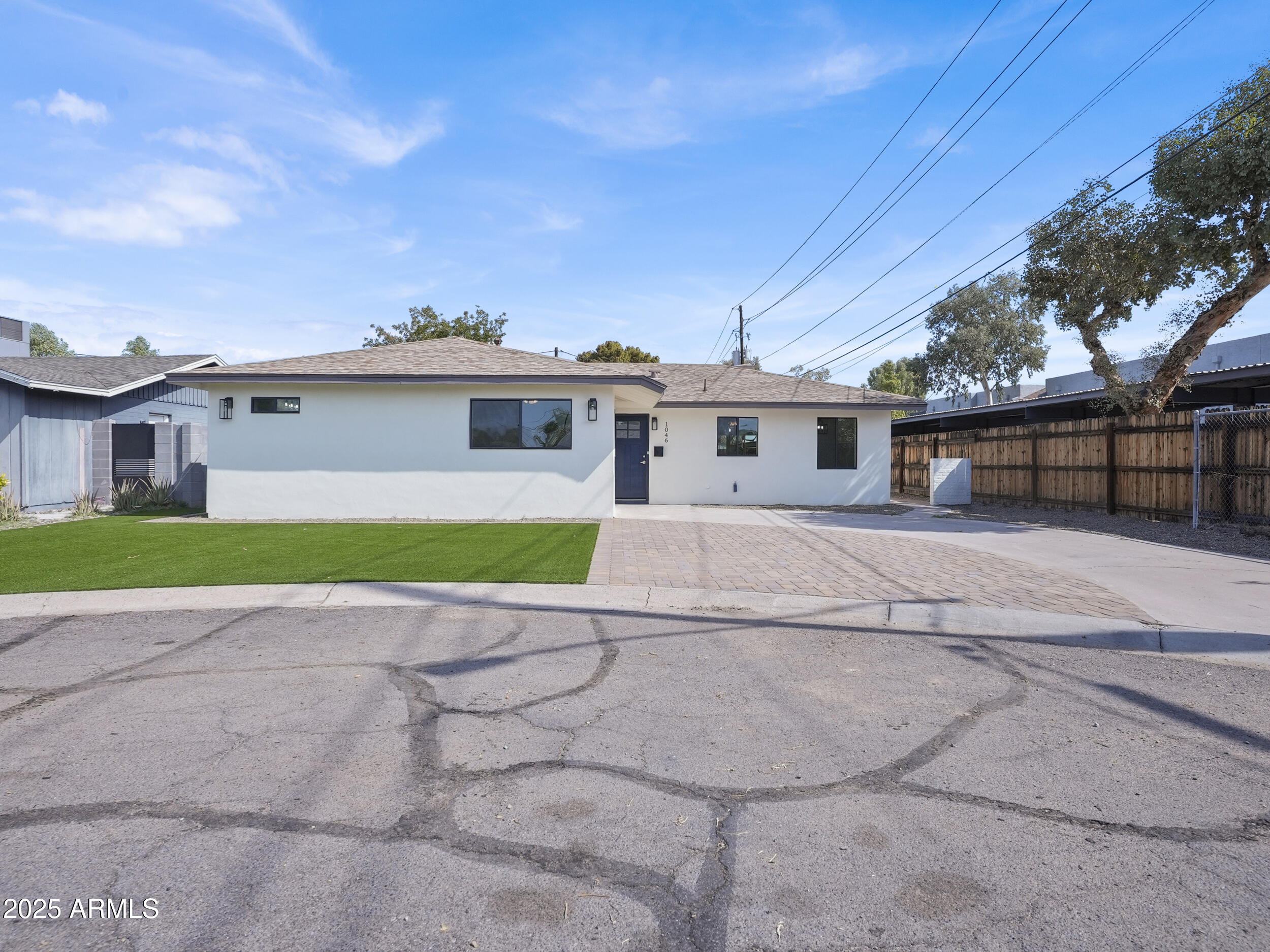 a view of house in front of a house with a big yard
