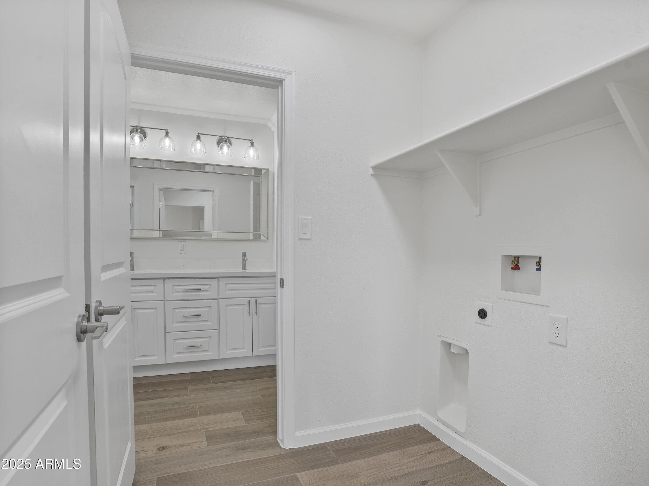 1046 East Elm Street Phoenix, AZ 85014 - Photo 12 of 31 a bathroom with a sink a mirror and vanity