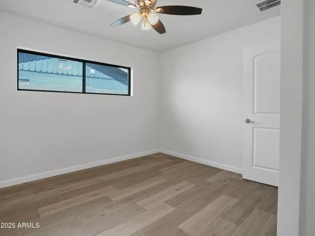 a bedroom with a bed and closet