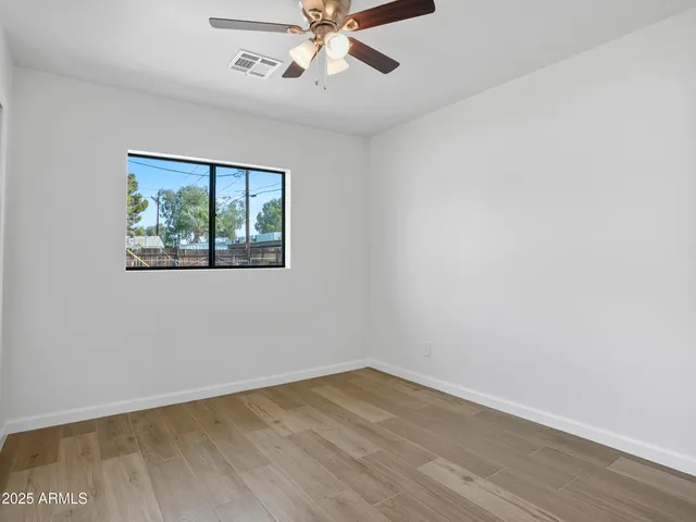 an aerial view of a residential houses with outdoor space
