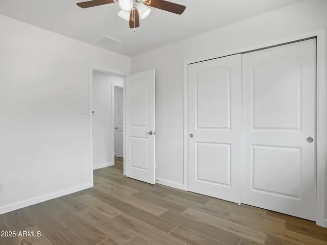 an aerial view of a house with a yard and trees