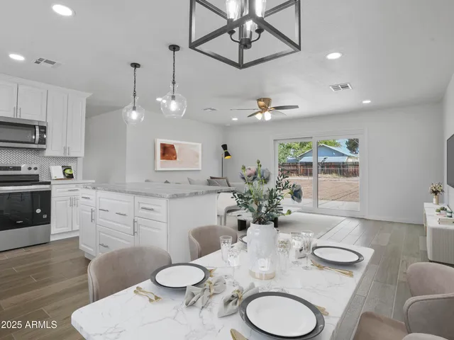 a view of an empty room with a painting on the wall