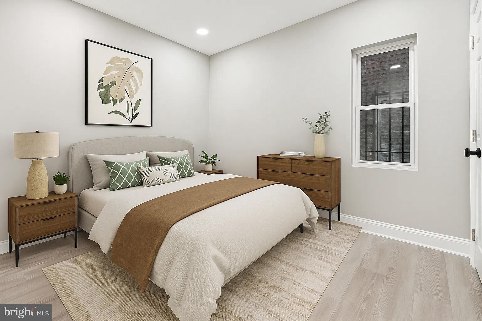 916 North Arlington Avenue, Unit 1 Baltimore, MD 21217 - Photo 11 of 14 a bedroom with a bed and a painting on the wall