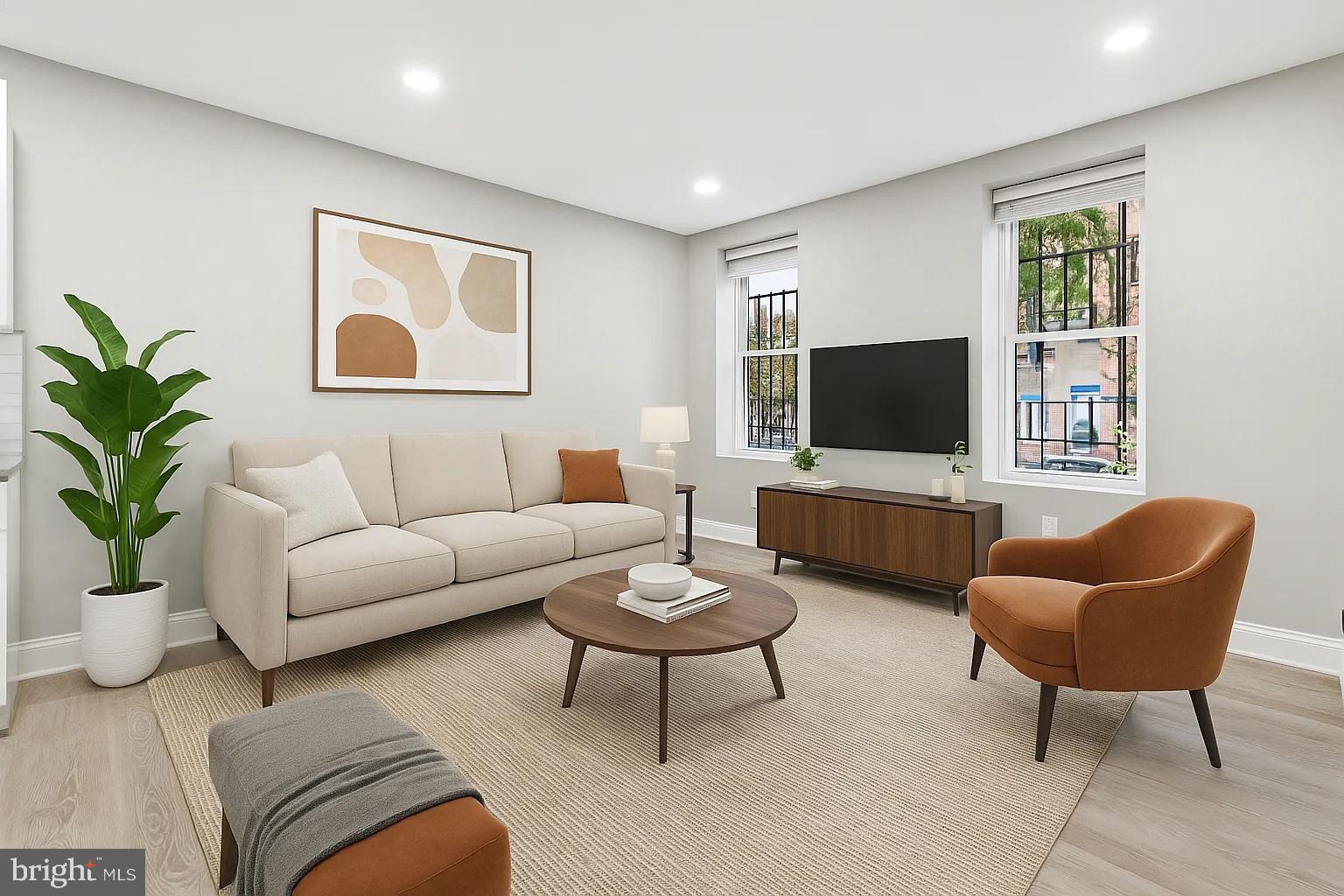 916 North Arlington Avenue, Unit 1 Baltimore, MD 21217 - Photo 6 of 14 a living room with furniture and a flat screen tv