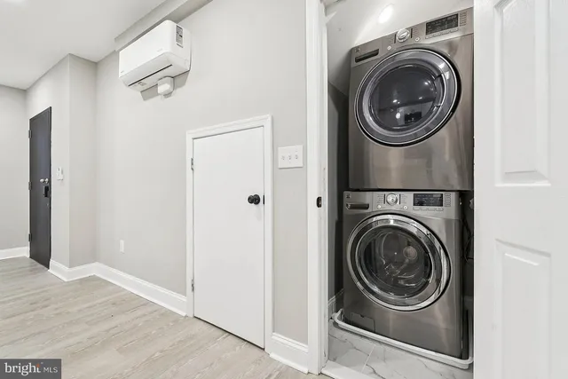 a view of a hallway with washer and dryer