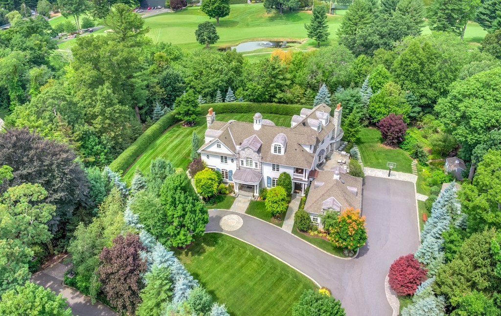 an aerial view of house with yard swimming pool and outdoor seating