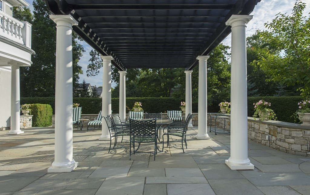 45 Young Road Weston, MA 02493 - Photo 12 of 18 a patio with glass top table and chairs