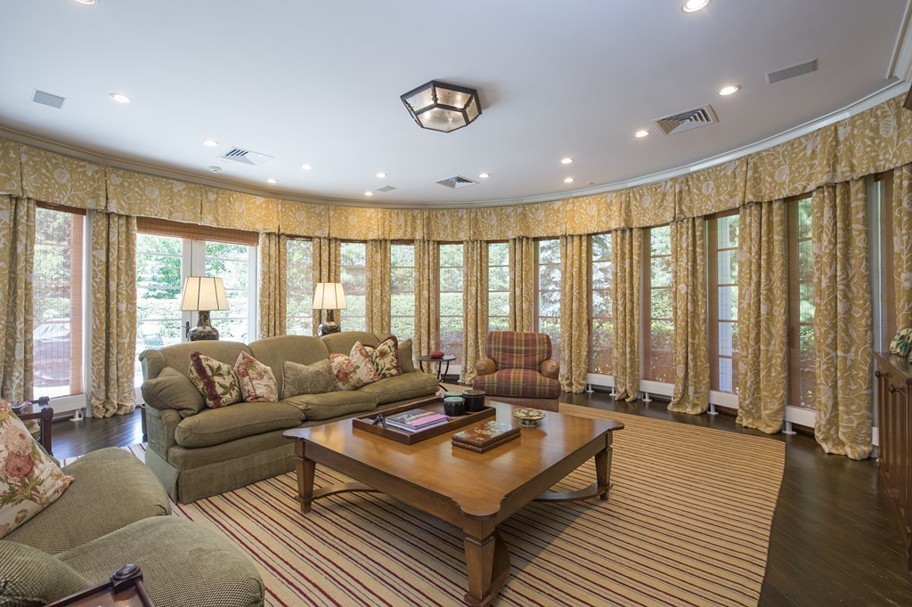 45 Young Road Weston, MA 02493 - Photo 13 of 18 a living room with furniture and large windows