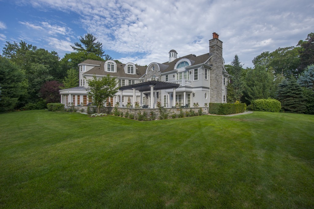 45 Young Road Weston, MA 02493 - Photo 3 of 18 a front view of a house with garden
