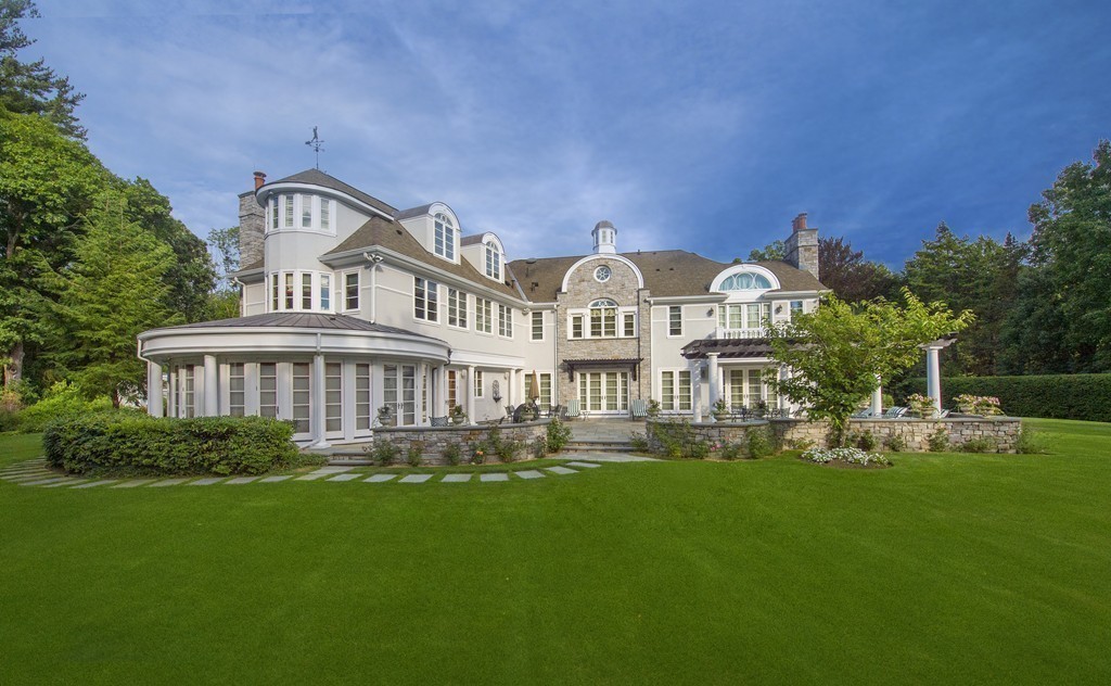 45 Young Road Weston, MA 02493 - Photo 8 of 18 a front view of a house with garden and trees